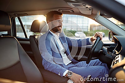 Businessman going on business trip by car Stock Photo