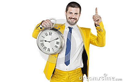 Businessman in a gold suit holding a clock in his hands Stock Photo