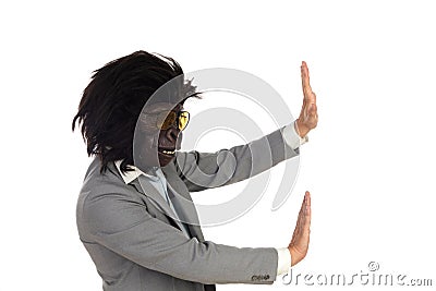 Businessman with gorilla head gesturing Stock Photo