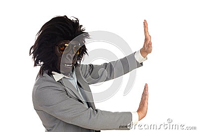 Businessman with gorilla head gesturing Stock Photo