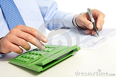 The businessman and green calculator Stock Photo