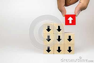 Businessman hand choose cube wooden toy blog with arrow icons concept of business for change leader to growth and success Stock Photo