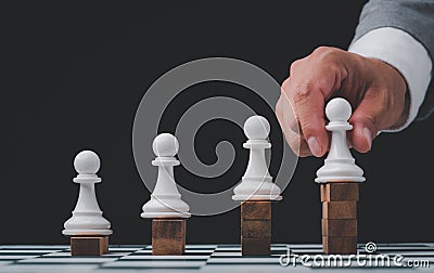 Businessman hand choose people with outstanding ability from the crowd,Successful team leader concept Stock Photo