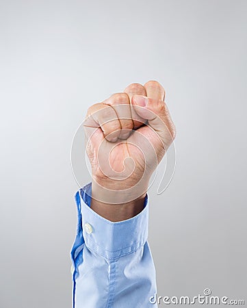 Businessman hand with clench fist Stock Photo