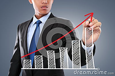 Businessman hand drawing virtual chart Stock Photo