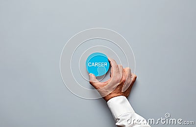 Businessman hand holding a blue badge with the word career. Professional career job offer or business career consultancy Stock Photo
