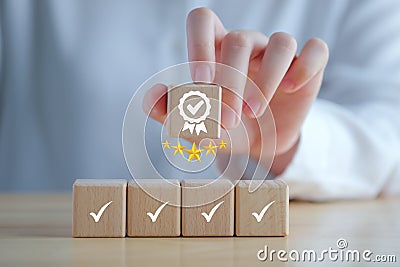 Businessman hand holding sign of the top service Quality assurance with 5 star. Guarantee, Standards, ISO certification concept. Stock Photo