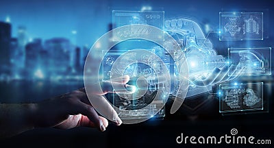 Businessman hand holding and touching wireframe holographic digital projection of an engine 3D rendering Stock Photo