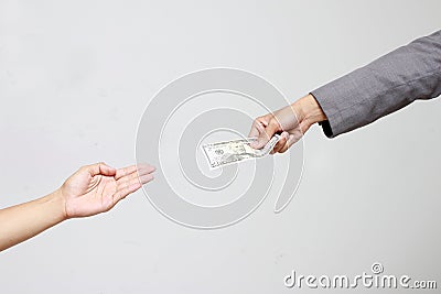 Businessman hand holding US dollar, USD. bills, offers dollar bank note money and giving money Paid for Something by Cash in Busin Stock Photo