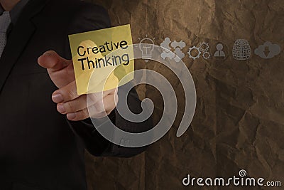 businessman hand point creative thinking on sticky note with icons crumpled recycle paper Stock Photo