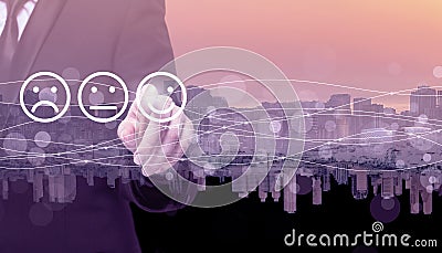 Businessman hand pointing on emoji icons on the background of city. Communication, technology, IoT, internet, global, futuristic Stock Photo