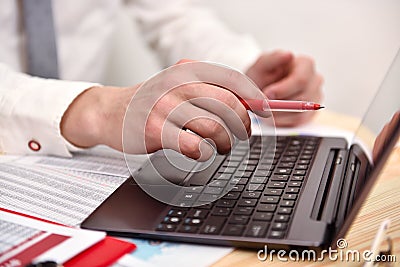 Businessman hand pointing to screen laptop Stock Photo