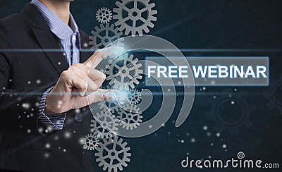 Businessman hand select wording free webinar. Stock Photo