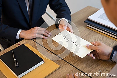 Businessman hand sending a resignation letter to executive boss dismissed worker quit out from company, Change job, unemployment, Stock Photo