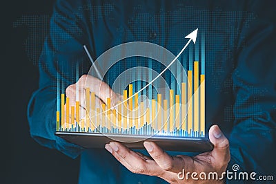 Businessman hand show Stock chart showing rising stock sign with graph indicator. Interest rate financial and mortgage rates Stock Photo