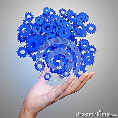 Businessman hand showing blue gears cogs Stock Photo