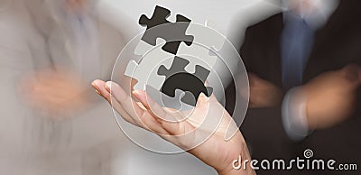 Businessman hand showing 3d puzzle partnership sign Stock Photo