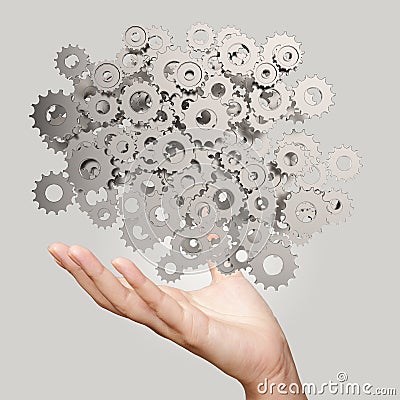 Businessman hand showing gears cogs Stock Photo