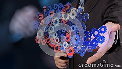 Businessman hand showing gears cogs Stock Photo