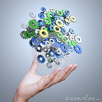 Businessman hand showing gears cogs to success Stock Photo