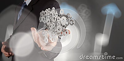 Businessman hand showing gears cogs to success Stock Photo