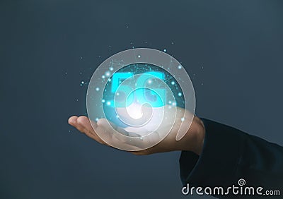 businessman hand showing hologram 5G digital technology, access to information around the world. 5G wireless internet network Stock Photo