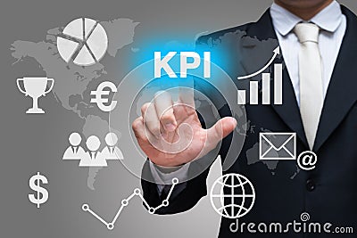 Businessman hand touch KPI symbols on gray background Stock Photo