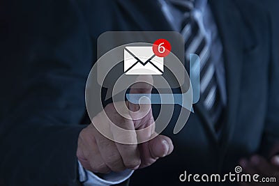 Businessman hand touching email on virtual screen. The inbox receives electronic message notifications. New email notification Stock Photo