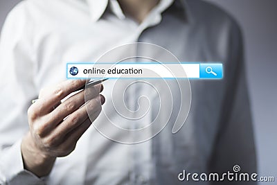 Man hand touching online education text Stock Photo