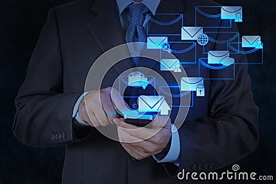 Businessman hand use smart phone computer with email icon Stock Photo