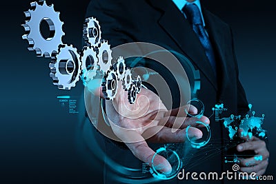 Businessman hand working with cog gear to success Stock Photo