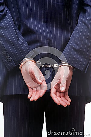 Businessman in handcuffs Stock Photo