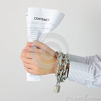 Businessman hands with chains and contract Stock Photo