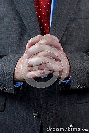 Businessman with hands clasped Stock Photo