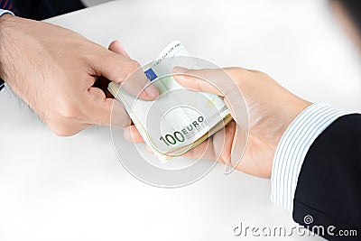 Businessman hands passing money, Euro currency (EUR) Stock Photo