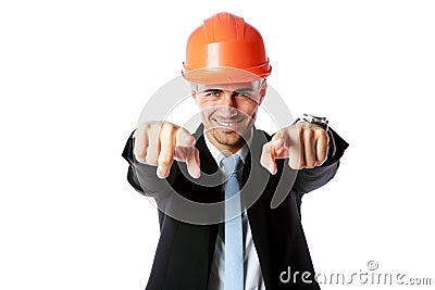 Businessman in hard hat pointing at you Stock Photo