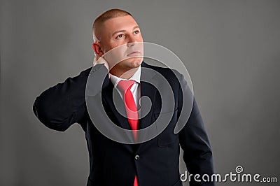 Businessman has pain of the cervical at work Stock Photo