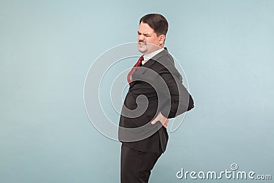 Businessman have kidney, lower back or hernia pain Stock Photo