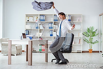 The businessman having fun taking a break in the office at work Stock Photo