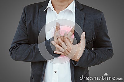 Businessman having a heart attack Stock Photo