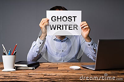 Businessman Hiding His Face Behind Card With Ghost Writer Text Stock Photo