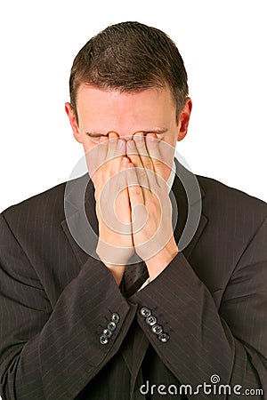 Businessman hiding his face in shame Stock Photo