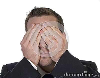 Businessman hiding his face in shame Stock Photo