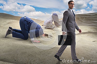 The businessman hiding his head in sand escaping from problems Stock Photo