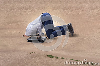 The businessman hiding his head in sand escaping from problems Stock Photo