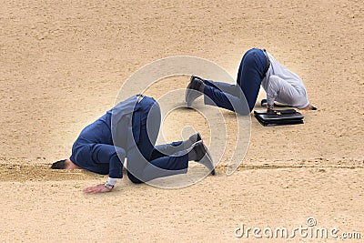 The businessman hiding his head in sand escaping from problems Stock Photo