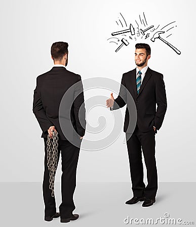 Businessman hiding a weapon Stock Photo