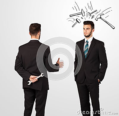 Businessman hiding a weapon Stock Photo