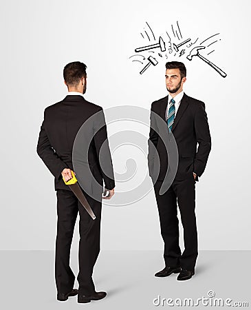 Businessman hiding a weapon Stock Photo