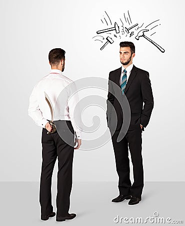 Businessman hiding a weapon Stock Photo